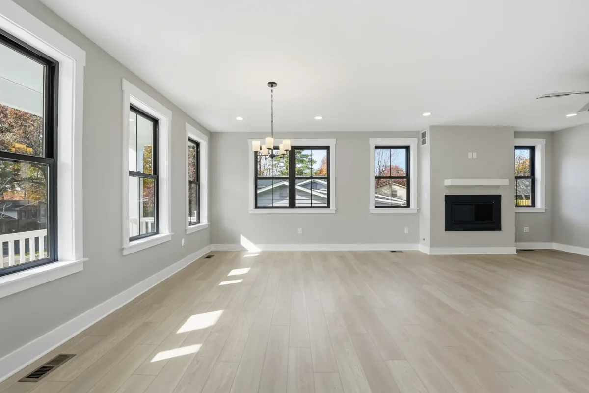 Living area with fireplace and large windows